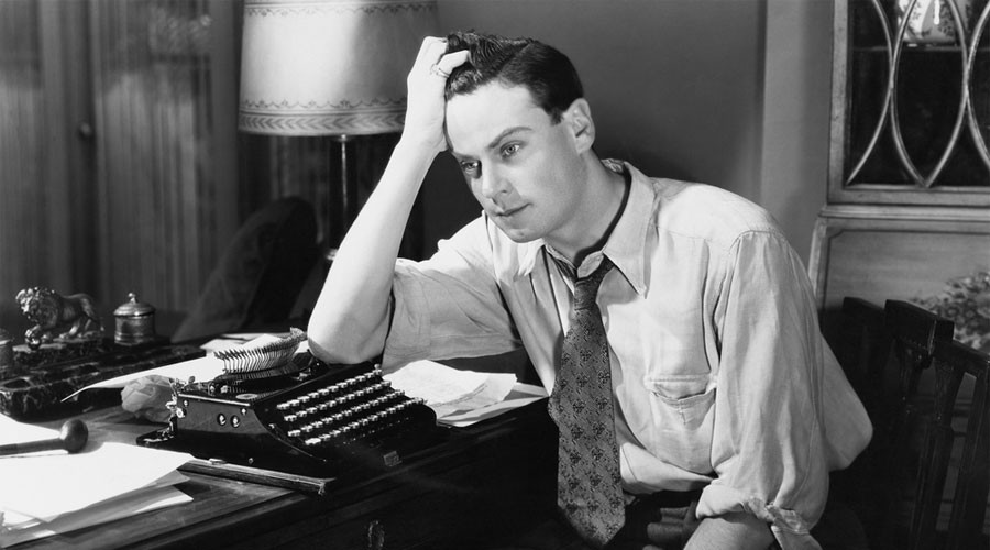 Vintage tired typist man black and white photo